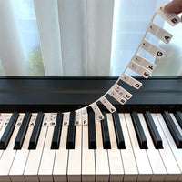 Removable silicone note labels for pianos and 88-key keyboards.