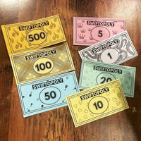 Music-based board game with song cards and Monopoly money for game nights