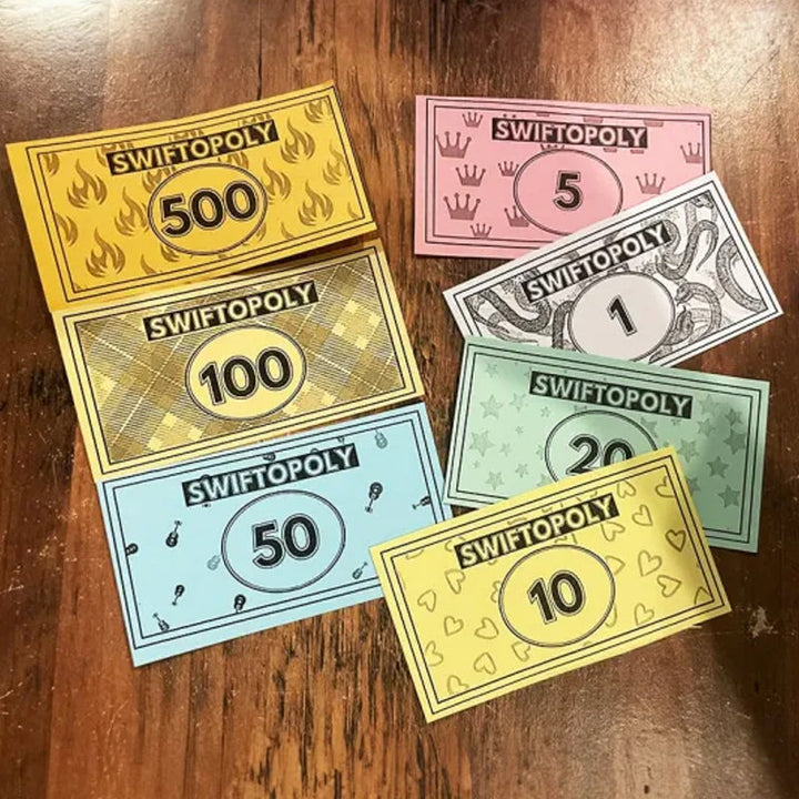 Music-based board game with song cards and Monopoly money for game nights