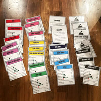Music-based board game with song cards and Monopoly money for game nights