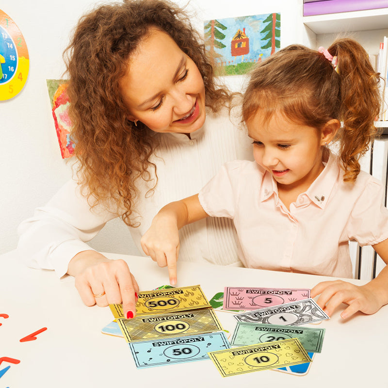 Music-based board game with song cards and Monopoly money for game nights