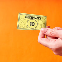 Music-based board game with song cards and Monopoly money for game nights