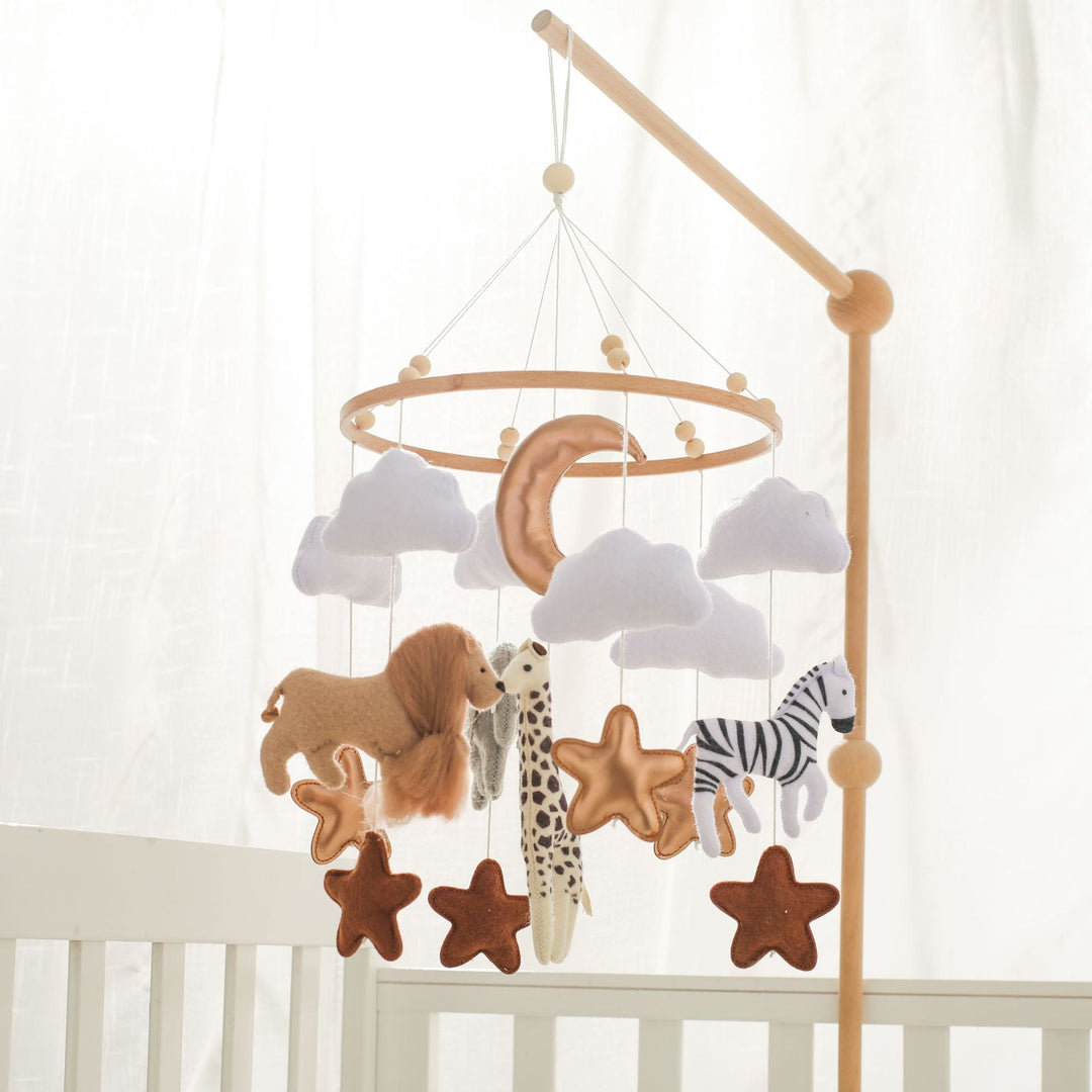 Mobile hanger with felt safari animals to stimulate babies' sensory perception.