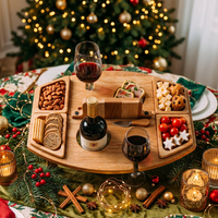 Overhead view of the wooden board spread with nuts, bread, tomatoes, cheese and two glasses of red wine 3