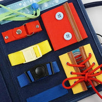 Motor skills learning board for children with buckles, zips and buttons – Leerplezier