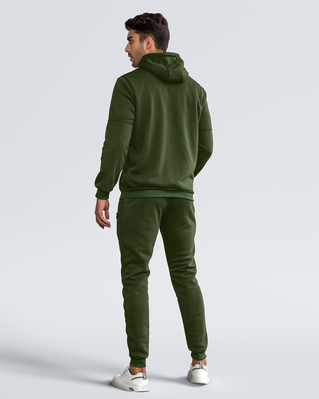 Back view of the olive green tracksuit on a model, showing hood, seamed sleeves and ribbed cuffs 7