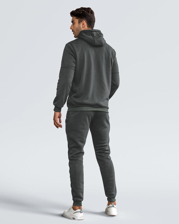 Back view of a man in the dark grey hooded set, with ribbed hem and cuffs 5