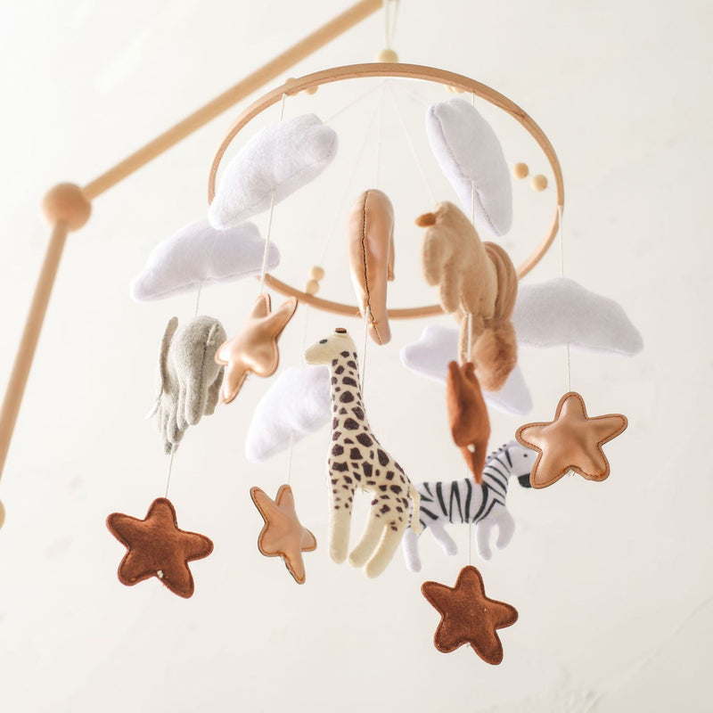 Mobile hanger with felt safari animals to stimulate babies' sensory perception.