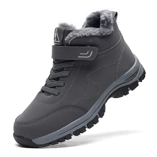 Dark grey high-top boot with fluffy lining, strap, laces and thick black-and-grey sole, side view 7