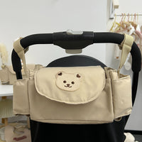 Hanging pram bag with bear motif – space-saving storage solution