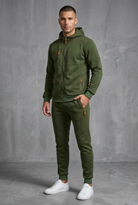 Olive green hooded zip tracksuit with orange zip pulls, worn by a model, front view, hand in pocket 6