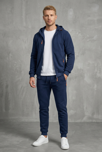 Front view of a navy zip-up hoodie and joggers with orange zips, worn over a white tee 2