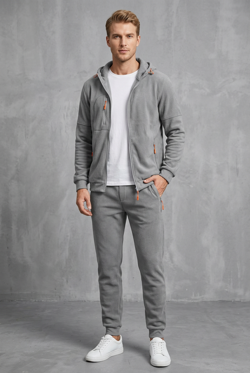 Front view of the light grey fleece-style zip-up hoodie and joggers with orange zips 10
