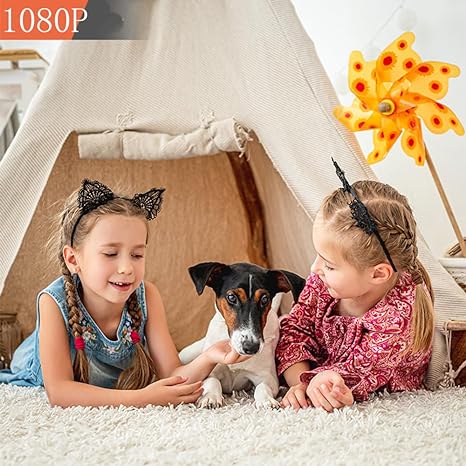 Two girls and a small dog sitting in a play tent, with a resolution badge in the corner 3
