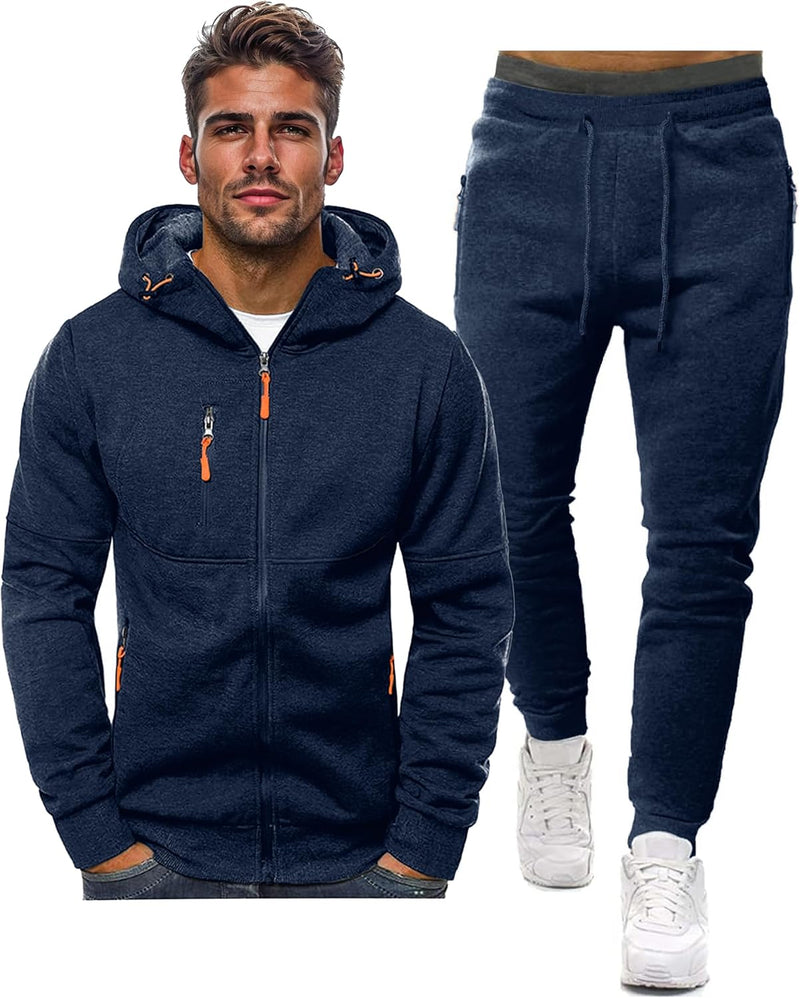 Navy zip-up hooded jacket with orange zip pulls beside matching drawstring joggers, shown as a set 1