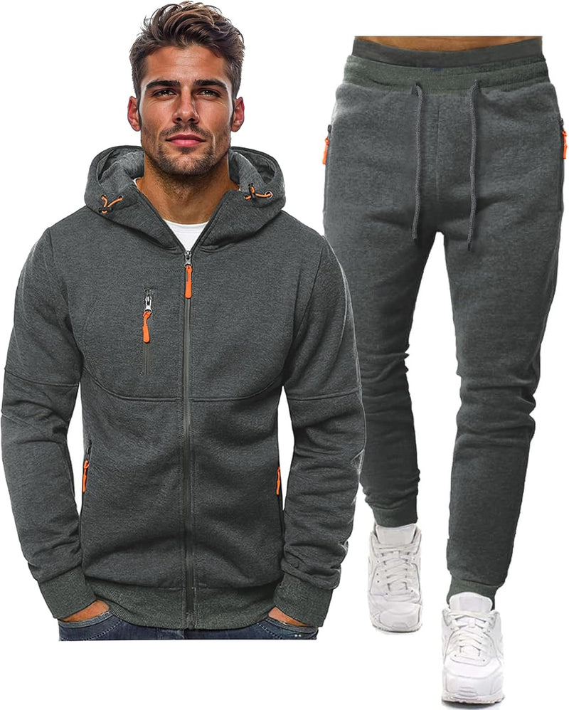 Dark grey zip hoodie with orange zip pulls beside matching drawstring joggers, shown on white 8