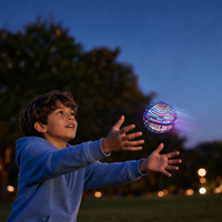 Kid catching glowing flying orb at dusk