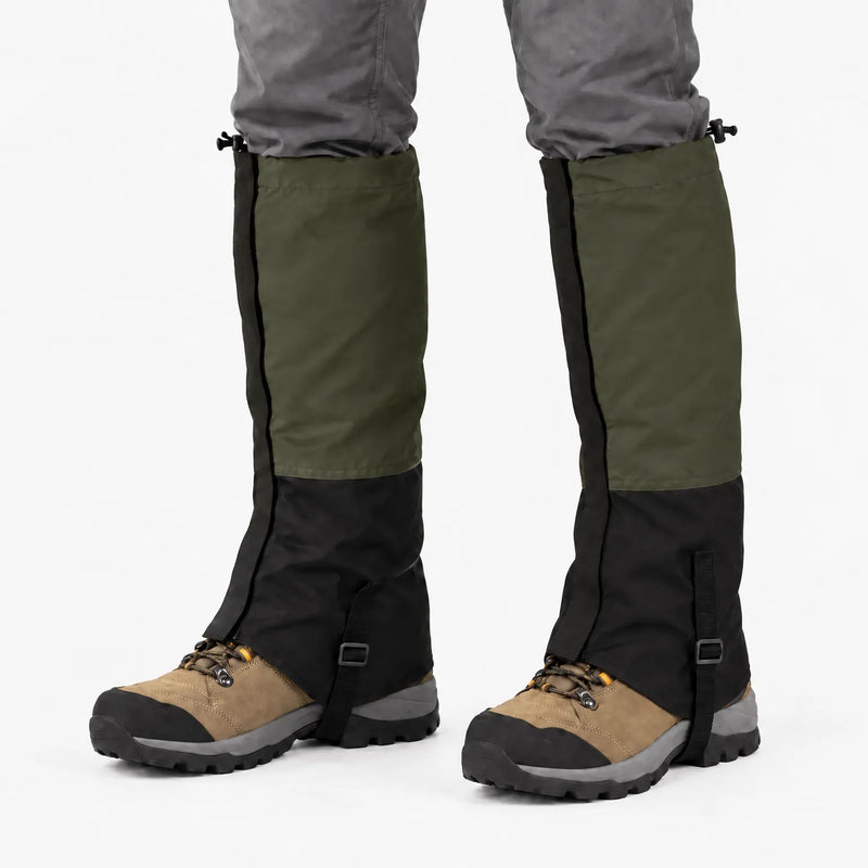 Olive green and black gaiters worn over hiking boots on a white background, with drawcords and instep straps 10