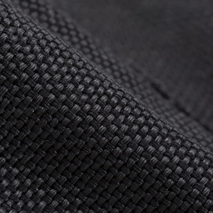 Close-up of the black woven fabric used on the lower part of the gaiters, showing its tight texture 5