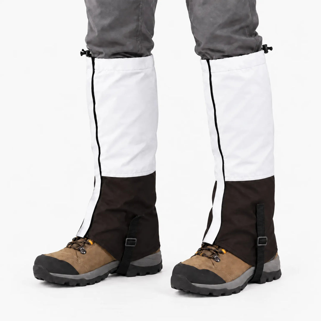 White upper and dark brown lower gaiters worn over hiking boots on a white background, with black instep straps 7