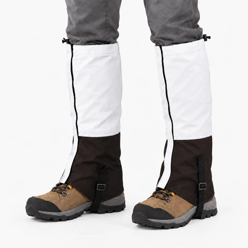 White upper and dark brown lower gaiters worn over hiking boots on a white background, with black instep straps 7