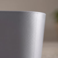 Close-up of the grey plastic basin's smooth, matt outer wall and rounded rim, showing a faint moulding seam. 3