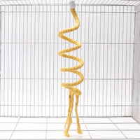Yellow spiral rope perch hanging from its white cap in a wire cage, shown with its knotted end and three frayed tails. 4
