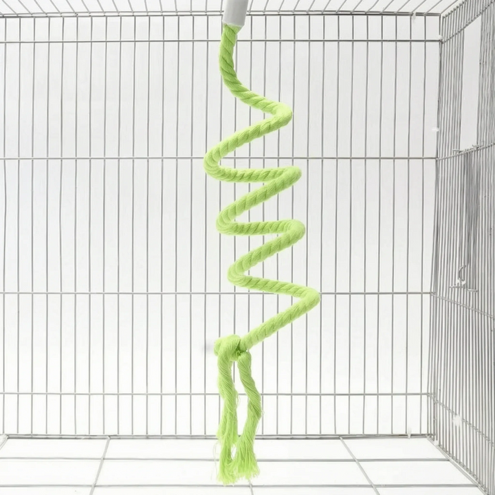 Light green version of the spiral rope perch hanging in a wire cage, with a knot and two frayed tails at the bottom. 5