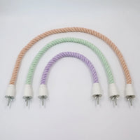 Three twisted cotton rope perches in peach, mint green and lilac, arranged in nested arches, each with white end caps and wing-nut bolts. 1