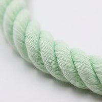 Close-up of the soft twisted cotton rope in mint green, showing the thick strands and fine fibre texture. 3
