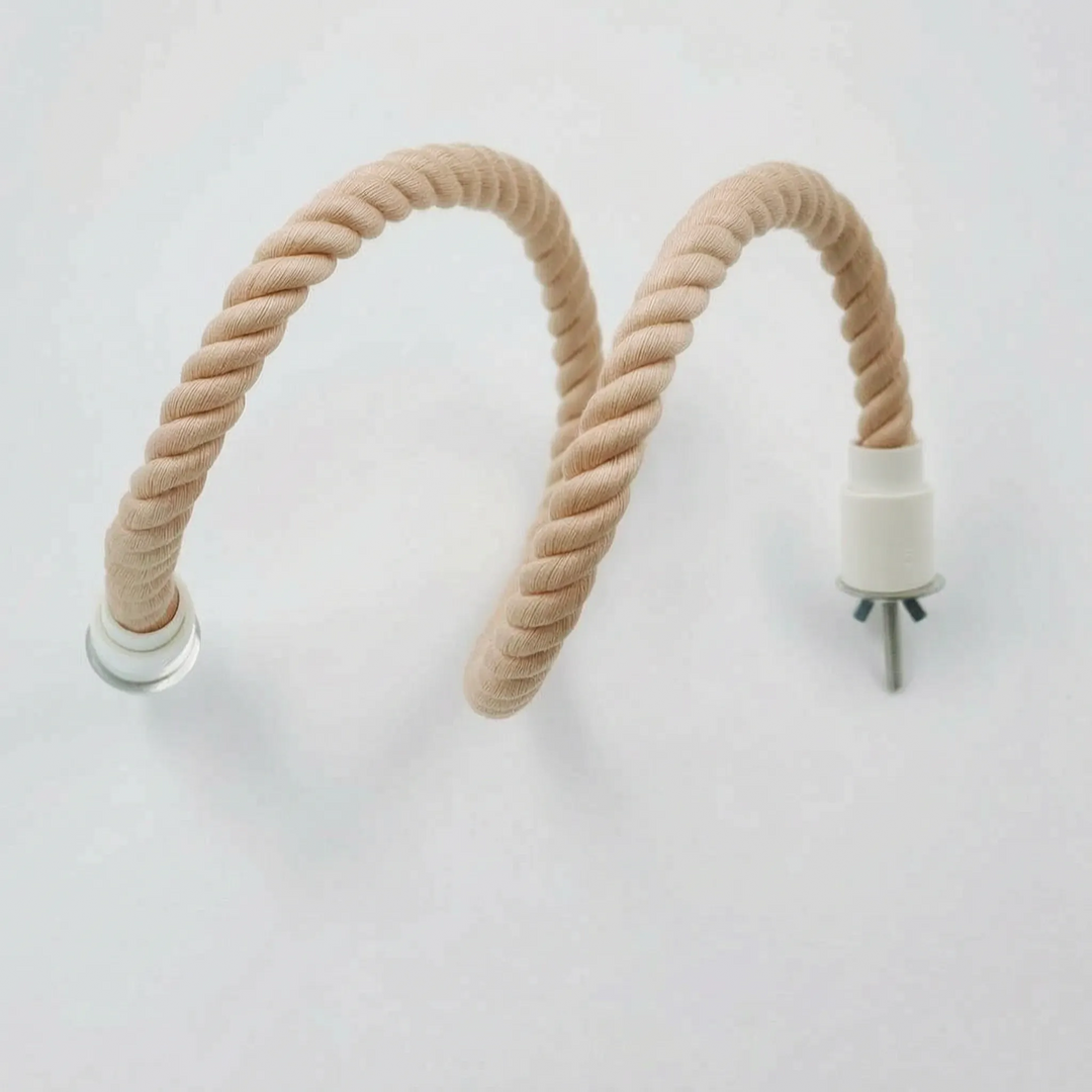 Peach-toned twisted rope perch bent into a wavy, flexible shape, showing one white end cap with bolt and one clear fitting. 6