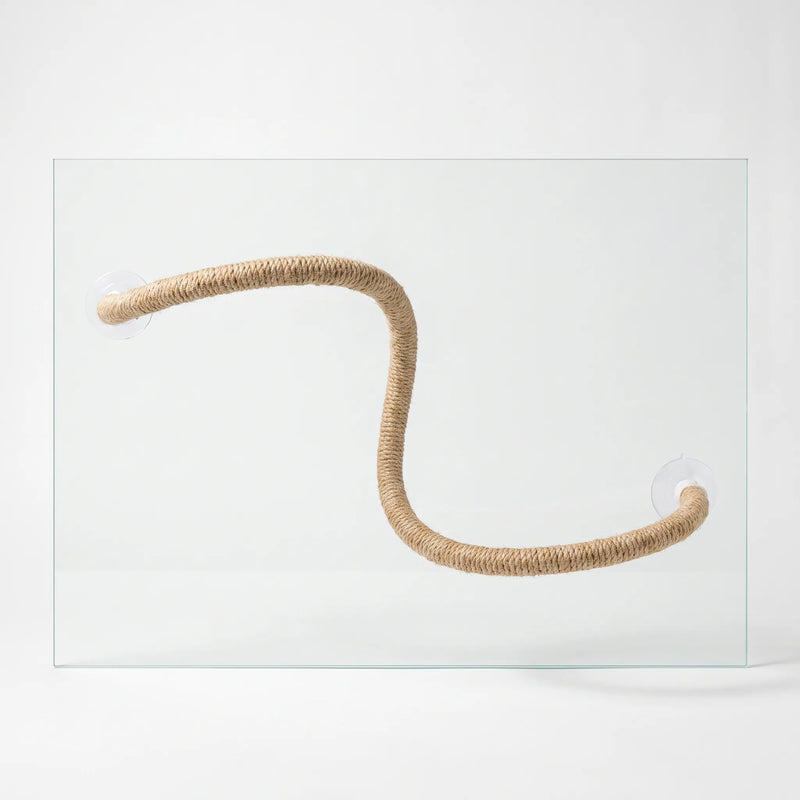Bendable natural rope perch bent into an S shape, held against a sheet of clear glass by a suction cup at each end. 1