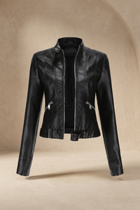 Black jacket unzipped, displayed against a sandy beige curved backdrop with a soft shadow below 10
