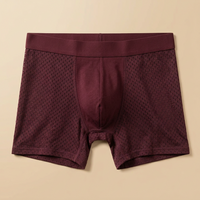 Burgundy boxer shorts laid flat, showing the mesh panels, stitched pouch seams and wide waistband 7