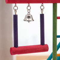 Close-up of the hanging swing with purple side posts, a red perch and a small silver bell between them. 4