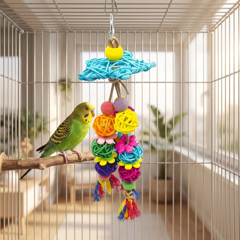 Toy hung from the roof of a cage beside a green budgerigar perched on a wooden branch, showing its size. 2