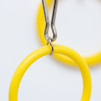 Close-up of the metal clip and small steel connecting ring joining the top yellow plastic rings. 4