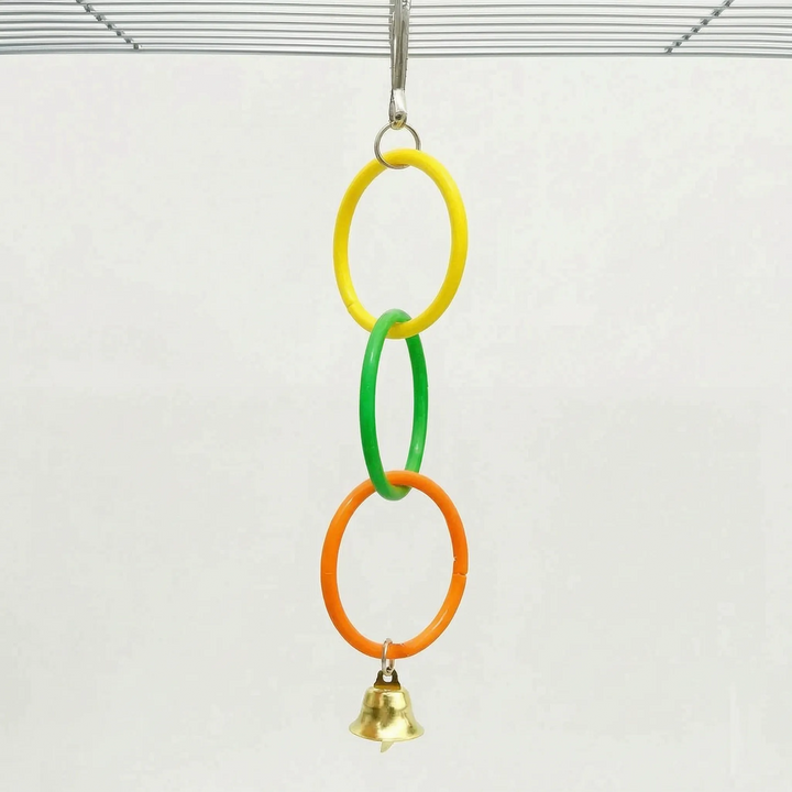 Shorter version of the toy with three linked rings in yellow, green and orange and a gold bell, hung from a cage roof. 5