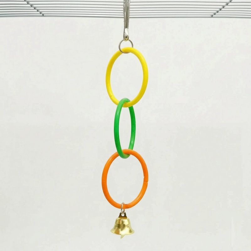 Shorter version of the toy with three linked rings in yellow, green and orange and a gold bell, hung from a cage roof. 5