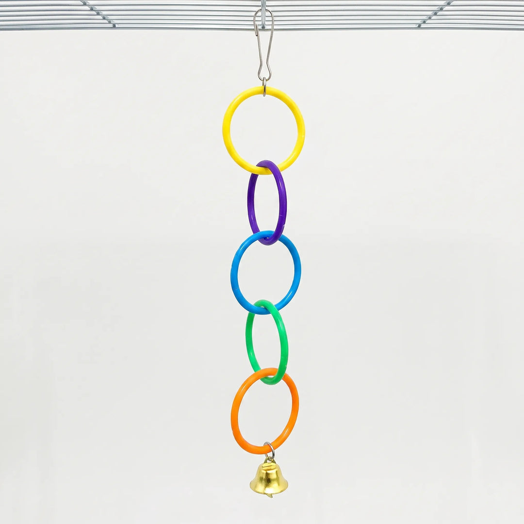 Full five-ring chain in yellow, purple, blue, green and orange with a bell, clipped to a cage roof against a plain background. 6