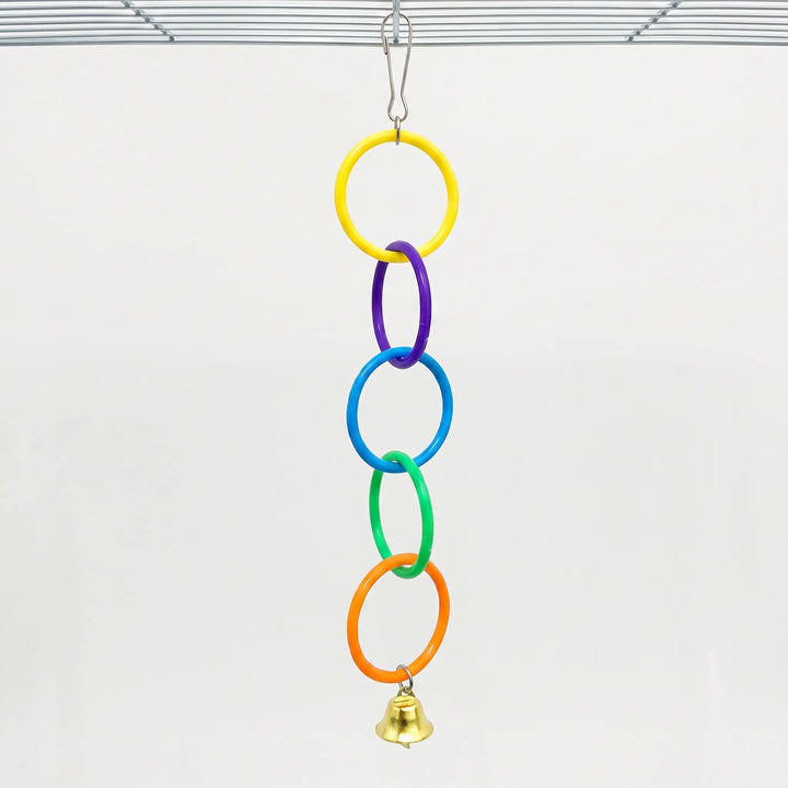 Full five-ring chain in yellow, purple, blue, green and orange with a bell, clipped to a cage roof against a plain background. 6