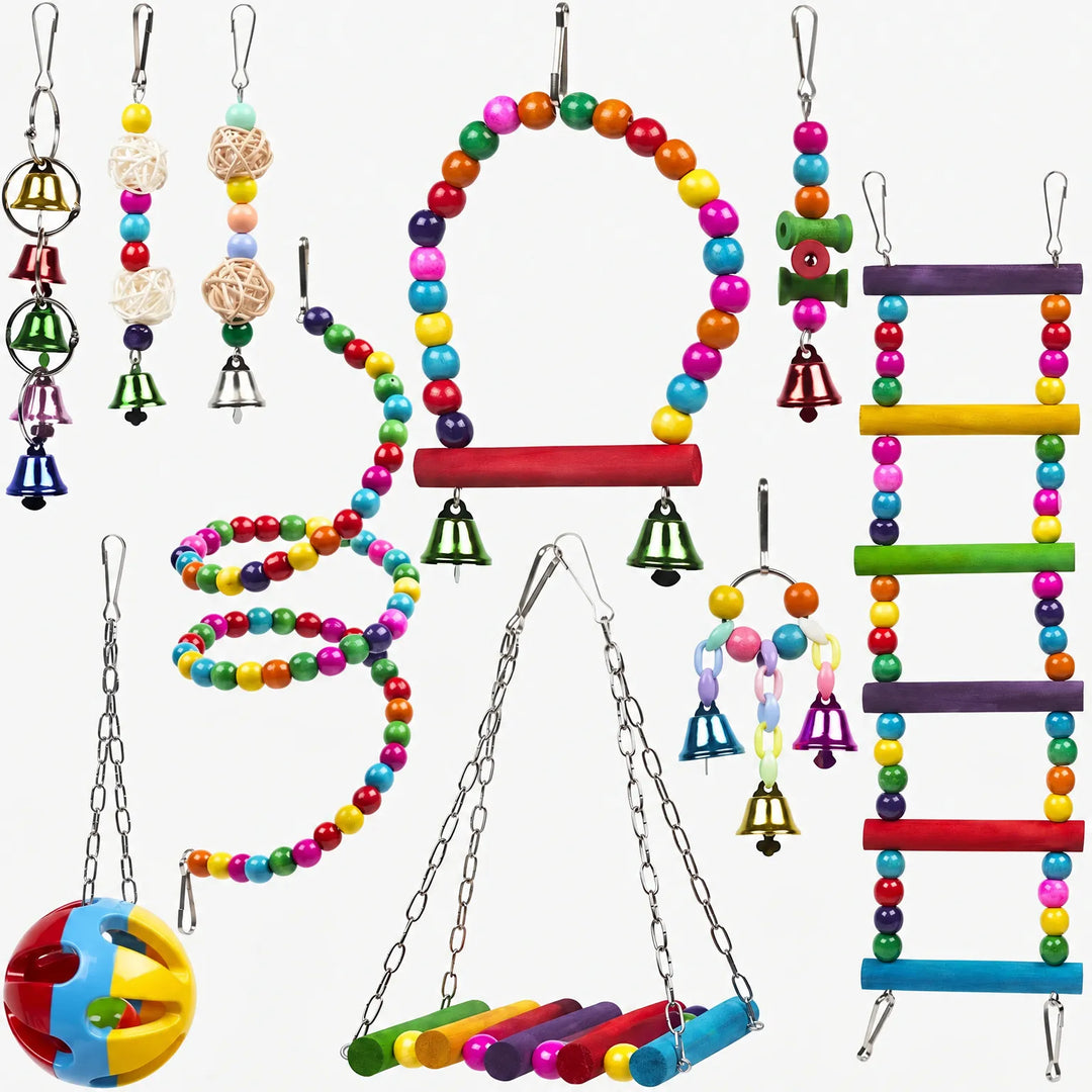 Ten colourful hanging bird toys laid out on white: beaded swing, spiral, ladder, bells, rattan balls, a perch swing and a plastic ball. 1