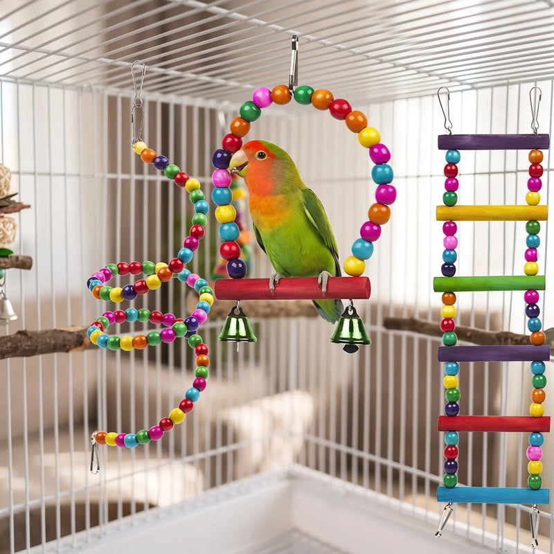 Lovebird on the beaded arch swing in a cage, beside a beaded spiral and a rainbow-rung ladder. 3