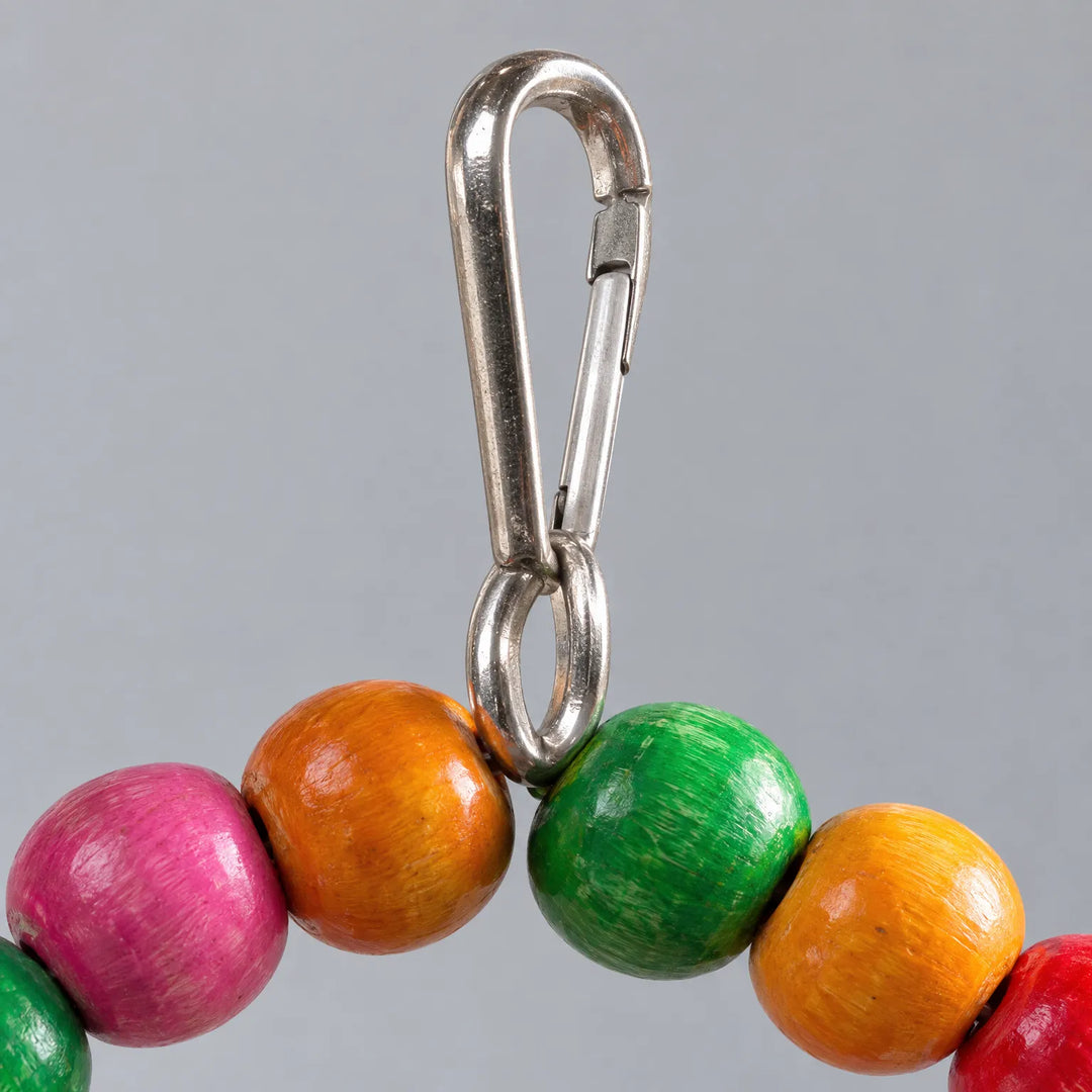 Close-up of the steel snap hook attached to the top of the colourful wooden bead arch. 4