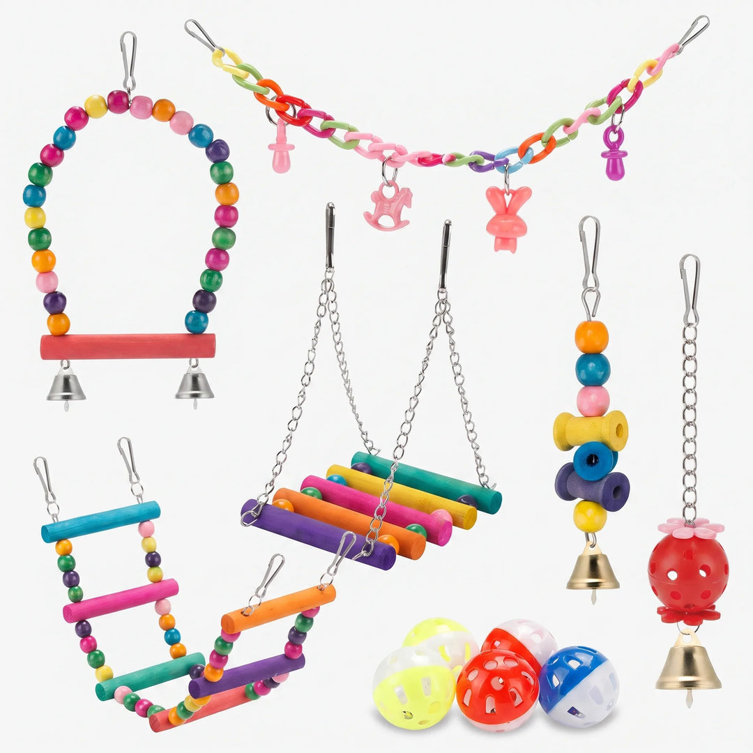 Flat lay of the full set: beaded swing, chain with charms, ladders, hanging bell toys and plastic bell balls on white. 1