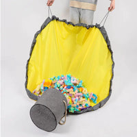 Large foldable toy tidy-up mat with basket function for the children's room.