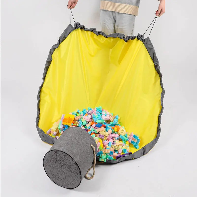 Large foldable toy tidy-up mat with basket function for the children's room.