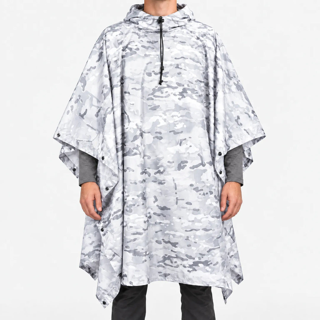 Front view of the hooded poncho in a white and light grey snow camouflage pattern, with snap closures along the sides. 11