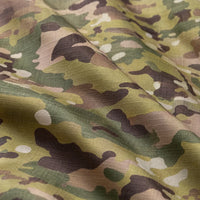 Close-up of the camouflage fabric in green, tan and brown, showing the woven ripstop texture and soft folds. 6