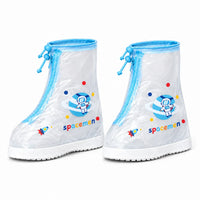 Pair of clear shoe covers with blue trim and drawstring toggles, an astronaut on a ringed planet and a small rocket print. 8